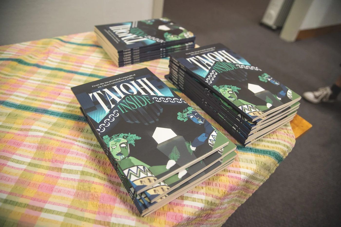 Copies of Taiohi Inside on a table.